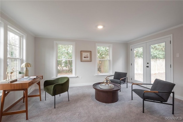 sitting room with french doors, carpet flooring, and crown molding