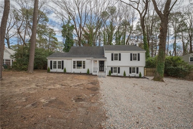 split level home with a chimney