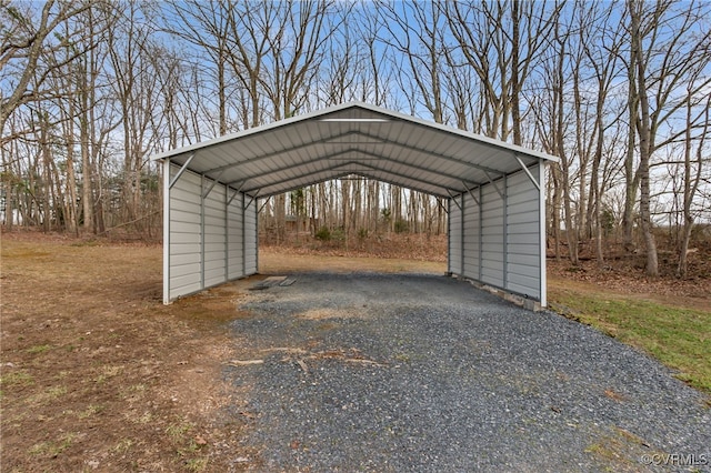 view of parking featuring driveway and a detached carport