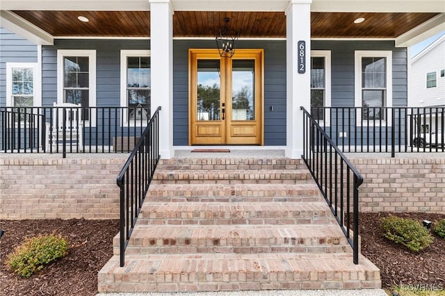 doorway to property featuring covered porch