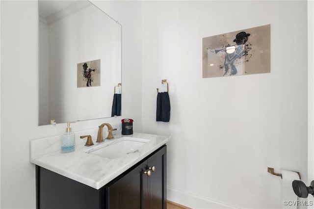 bathroom with baseboards and vanity