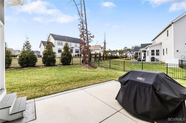 view of patio / terrace featuring a residential view, a fenced backyard, and area for grilling