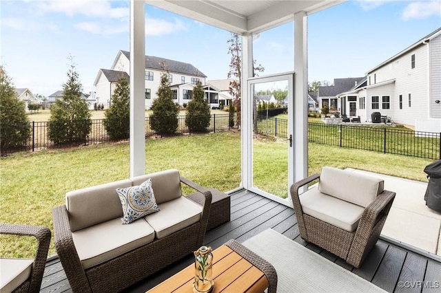 sunroom / solarium with a residential view