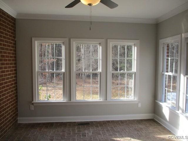 unfurnished sunroom featuring a wealth of natural light