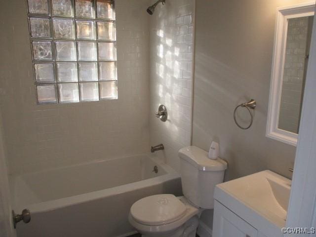 bathroom featuring vanity, shower / tub combination, and toilet