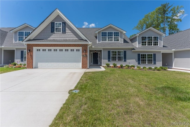 view of front of home with driveway, a garage, roof with shingles, a front lawn, and brick siding