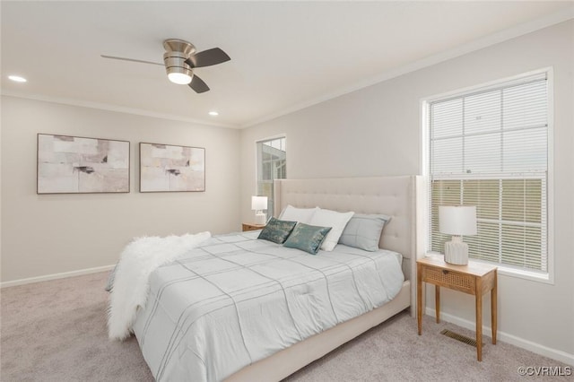 bedroom featuring carpet floors, ornamental molding, and baseboards