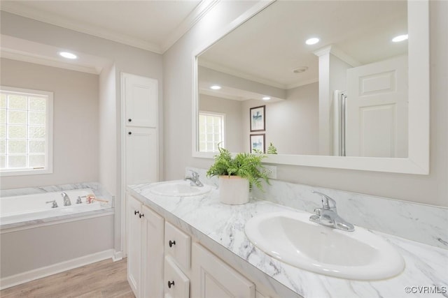 full bath with ornamental molding, a sink, and double vanity