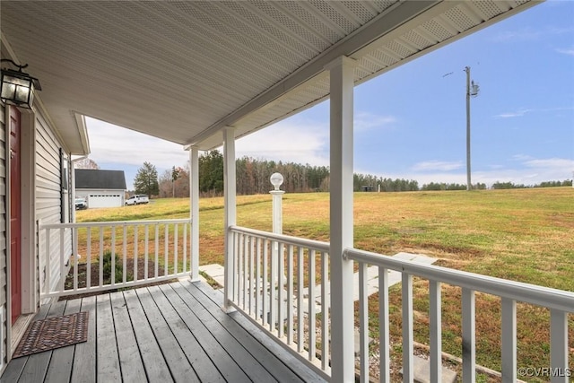 wooden deck featuring a yard