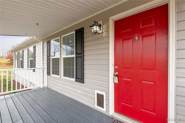 doorway to property featuring covered porch