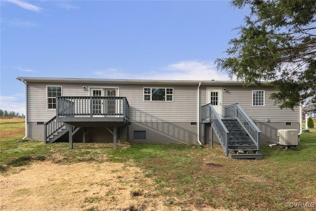 back of property with crawl space, stairs, a deck, cooling unit, and a yard