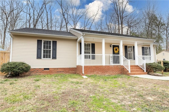 ranch-style home with a porch, a front yard, and crawl space