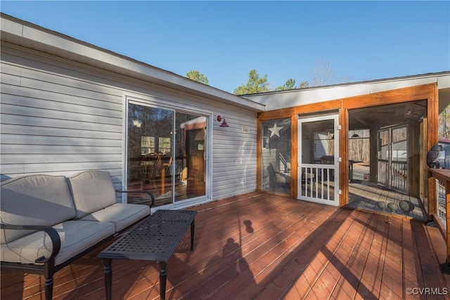 wooden terrace featuring an outdoor hangout area