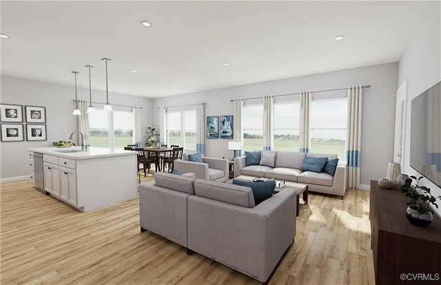 living area with light wood-style floors, baseboards, and recessed lighting