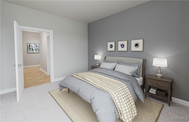 bedroom with baseboards and light colored carpet