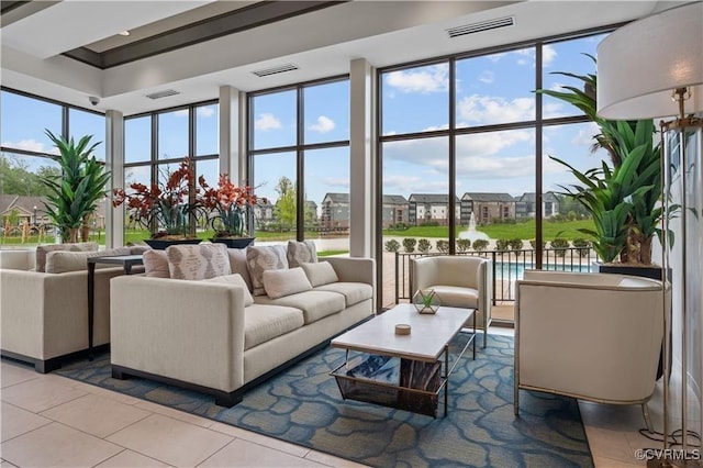 living area featuring visible vents and tile patterned floors