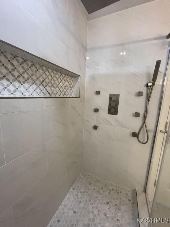 full bath with a shower stall