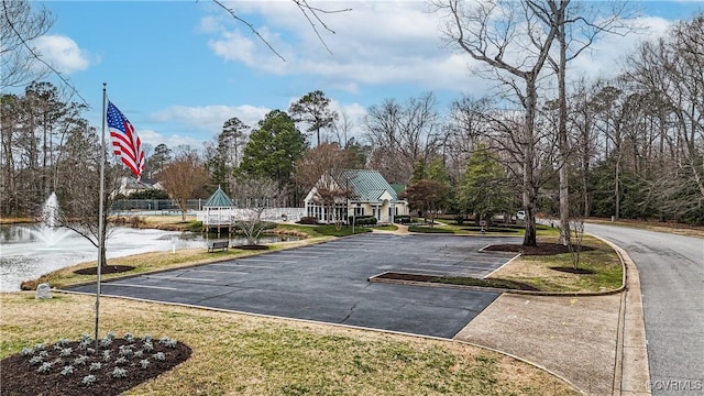 view of property's community featuring uncovered parking