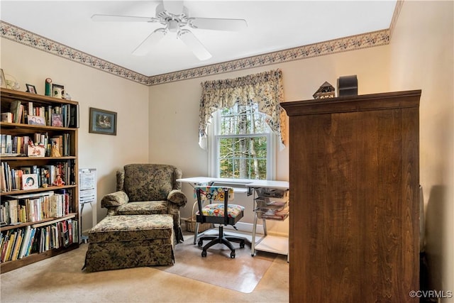 living area with ceiling fan and carpet floors