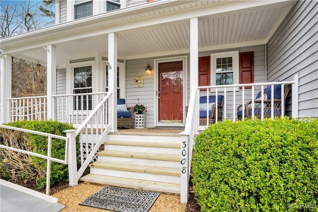 doorway to property featuring covered porch