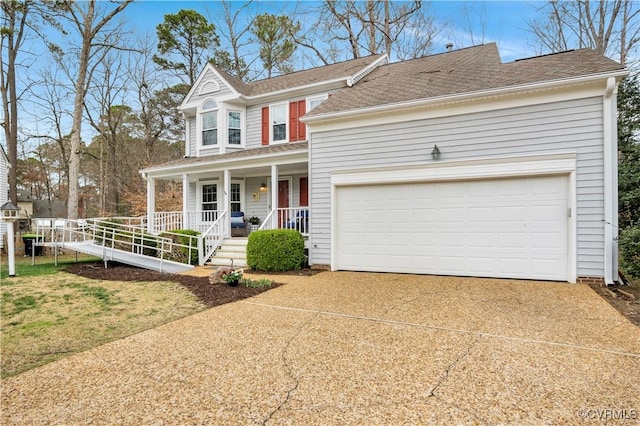 view of front of house with covered porch, a garage, and driveway