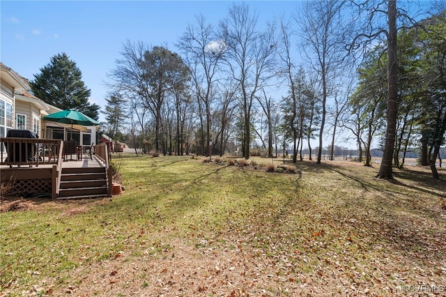 view of yard featuring a wooden deck