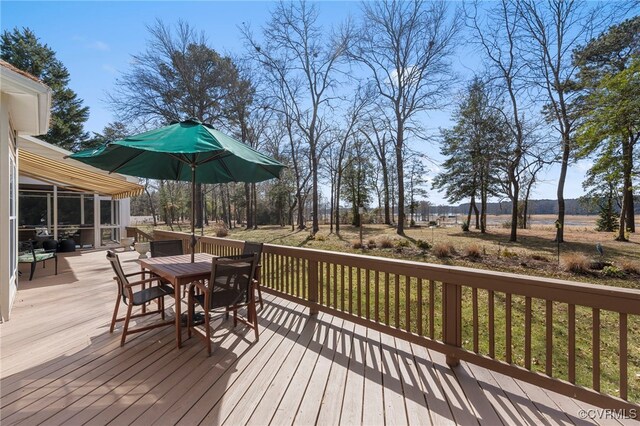 wooden deck with outdoor dining area