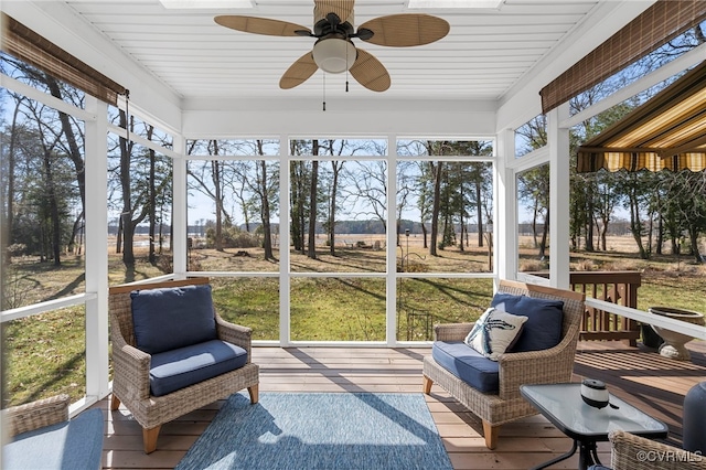 sunroom with an outdoor living space and ceiling fan