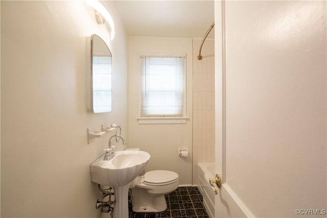 full bath with tile patterned flooring, bathing tub / shower combination, and toilet