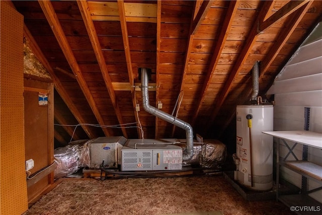 unfinished attic featuring water heater