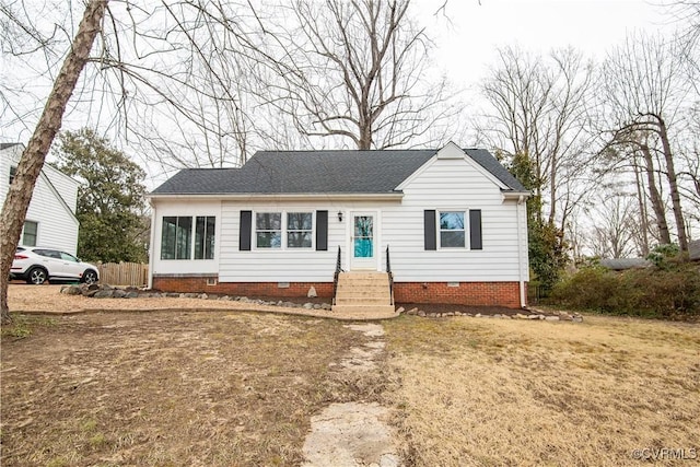 view of front of house with entry steps, roof with shingles, and crawl space