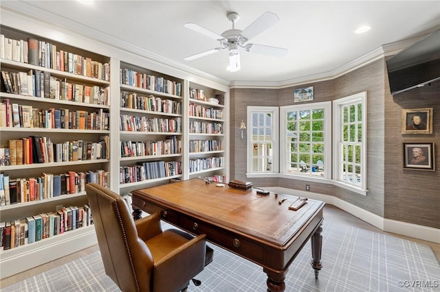 office space with wallpapered walls, baseboards, ornamental molding, and a ceiling fan