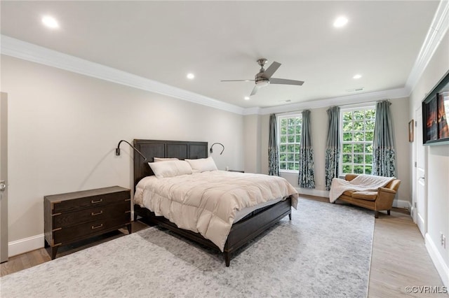 bedroom with crown molding, recessed lighting, baseboards, and light wood-style floors