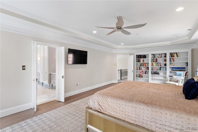 bedroom featuring baseboards, recessed lighting, wood finished floors, and crown molding