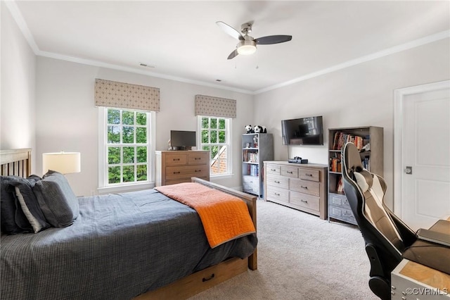 bedroom featuring carpet floors, a ceiling fan, visible vents, and crown molding