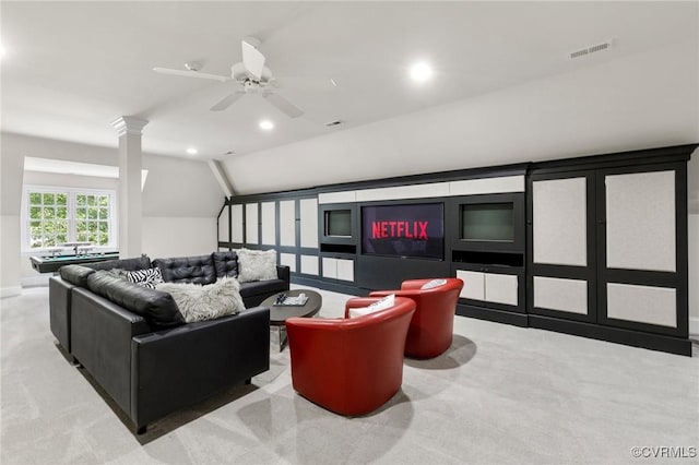 living room featuring vaulted ceiling, carpet, decorative columns, and recessed lighting