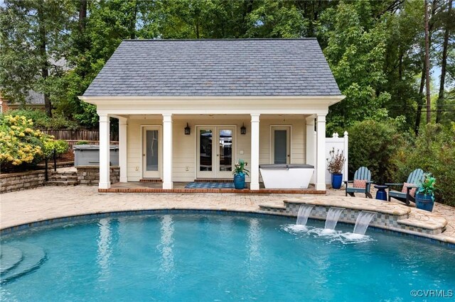 outdoor pool with a patio, a storage structure, an outdoor structure, and fence