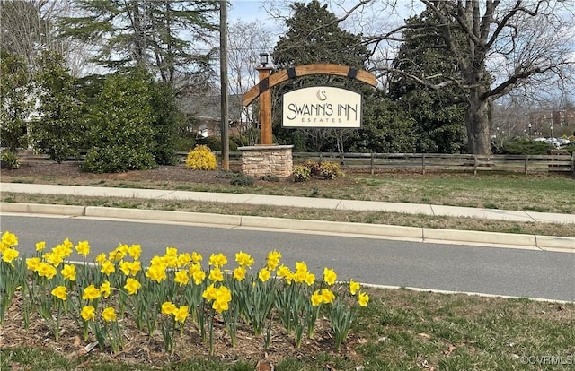 community sign with fence