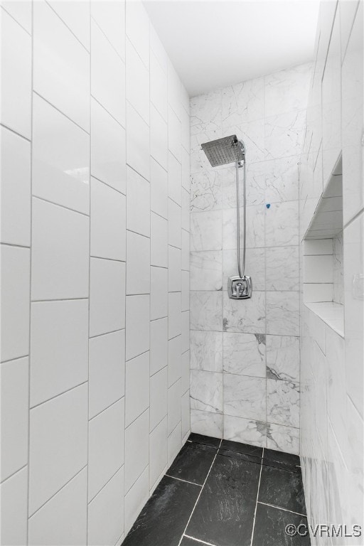 bathroom with tiled shower