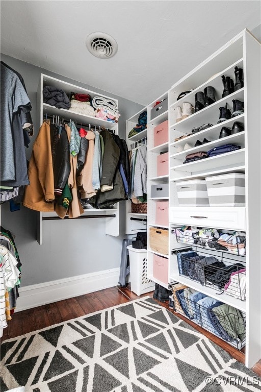 spacious closet with visible vents and wood finished floors