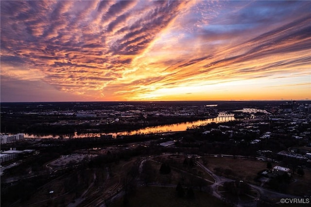 aerial view at dusk with a water view