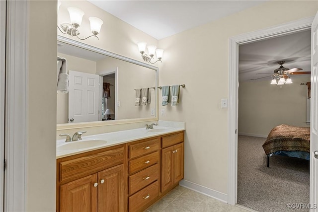 full bathroom featuring a sink, connected bathroom, a ceiling fan, and double vanity