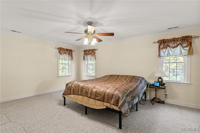 bedroom featuring multiple windows, crown molding, and baseboards