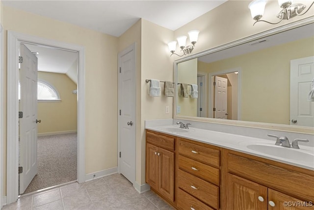 full bath featuring tile patterned floors, double vanity, visible vents, and a sink