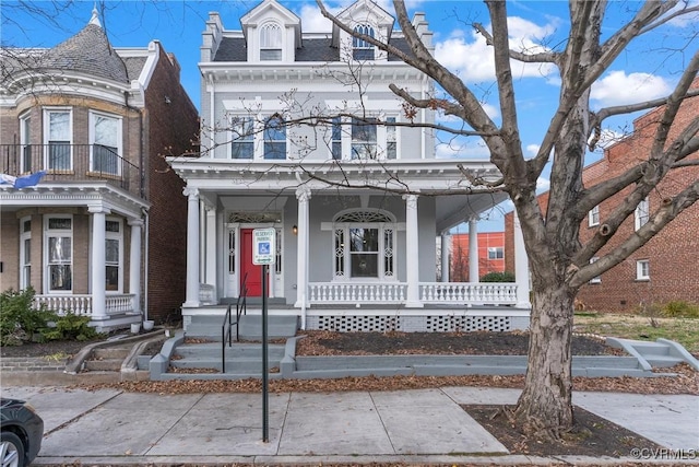 view of front of home with covered porch and a balcony