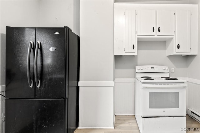 kitchen featuring light wood finished floors, white cabinets, electric stove, freestanding refrigerator, and light countertops