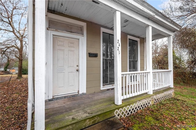 view of exterior entry featuring a porch