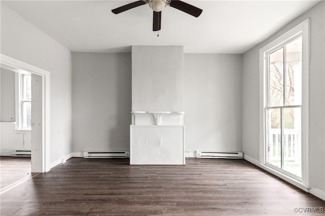 empty room featuring a healthy amount of sunlight, a baseboard radiator, and a baseboard heating unit