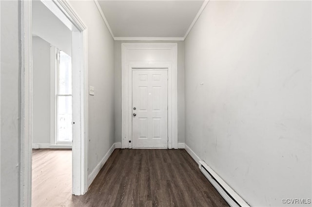 doorway to outside with ornamental molding, a baseboard radiator, wood finished floors, and baseboards