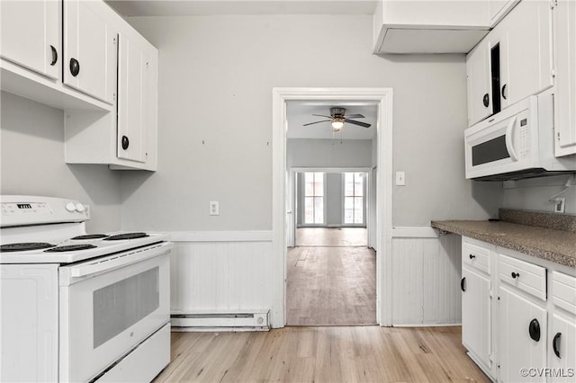 kitchen featuring a baseboard radiator, white appliances, white cabinetry, wainscoting, and light wood finished floors